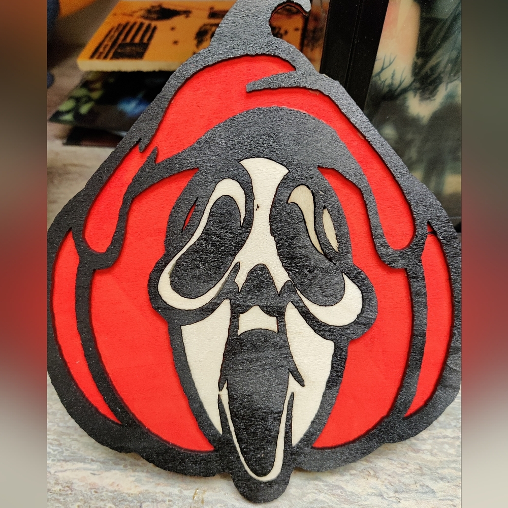 Ghost face pumpkin wall hanging